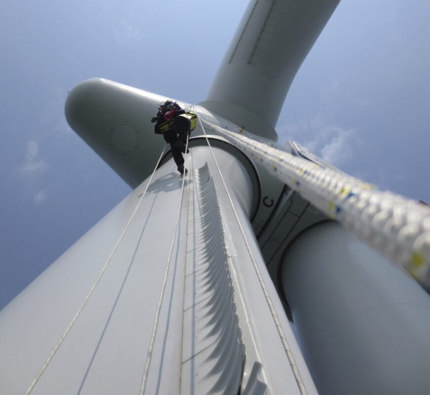 Rotor blade repair company working on a wind turbine.